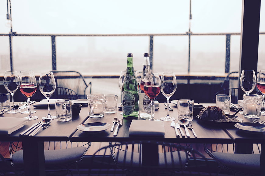 Elegant Table Setting with Wine and Sparkling Water
