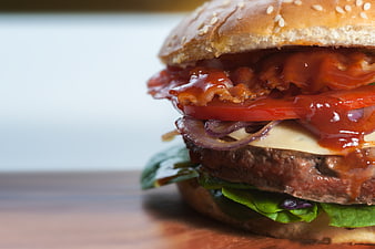 Close-up of a delicious bacon cheeseburger with fresh ingredients