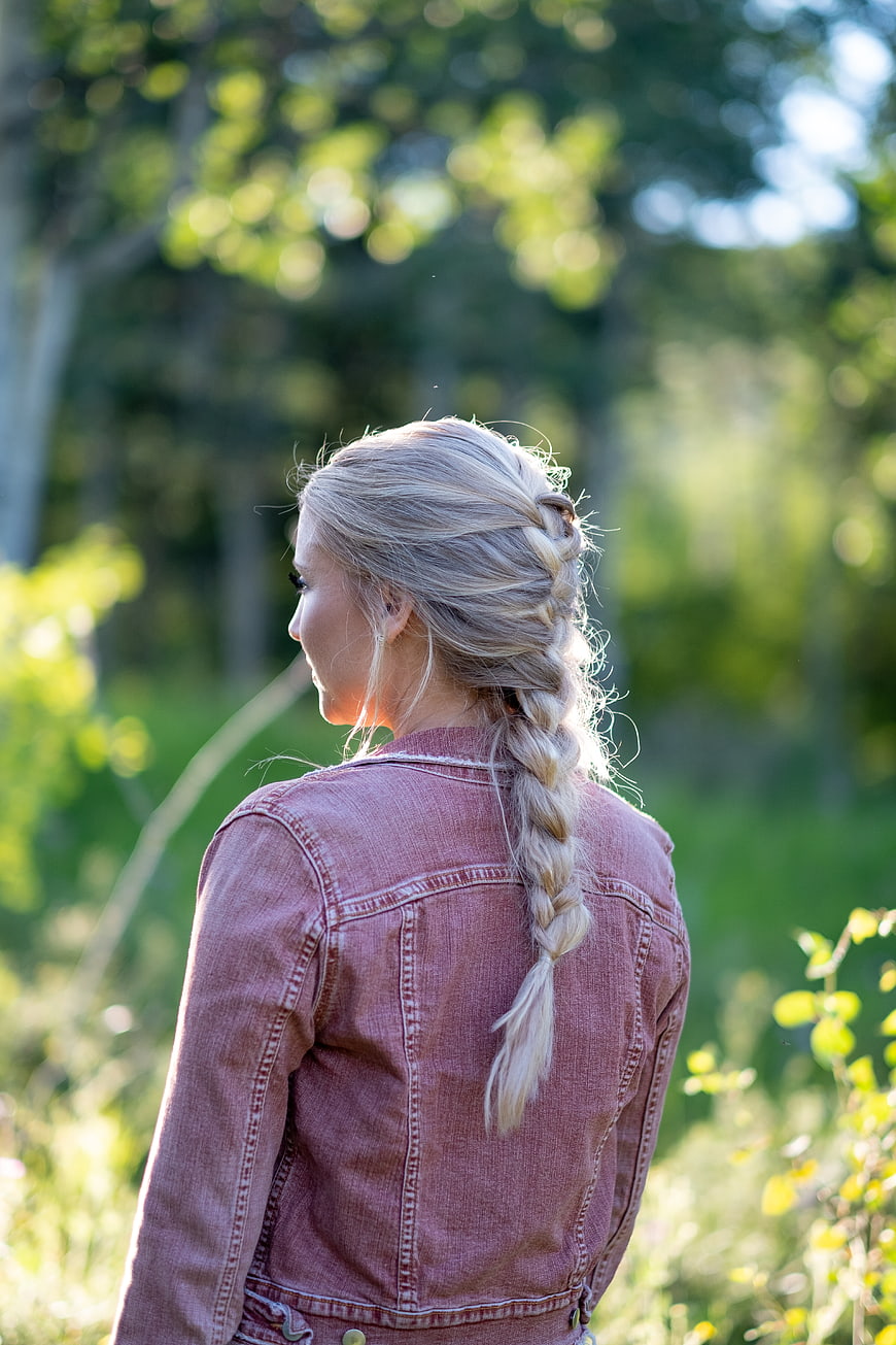 Blonde Woman with Braid in Pink Denim Jacket Outdoors