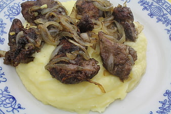 Sliced Liver With Caramelized Onions Served On Mashed Potatoes