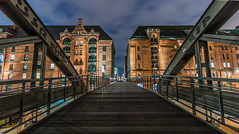 Night view of Speicherstadt Hamburg bridge and historic brick warehouses