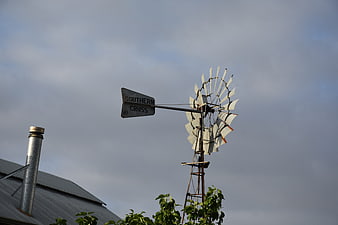 Vintage Southern Cross Windmill on Farm Roof