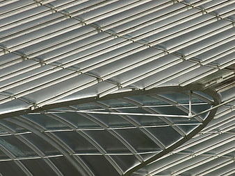 Abstract modern metal roof architecture with curved steel beams