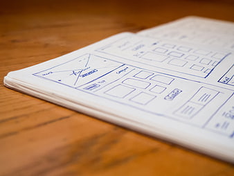 Hand-drawn wireframe sketch on notebook paper
