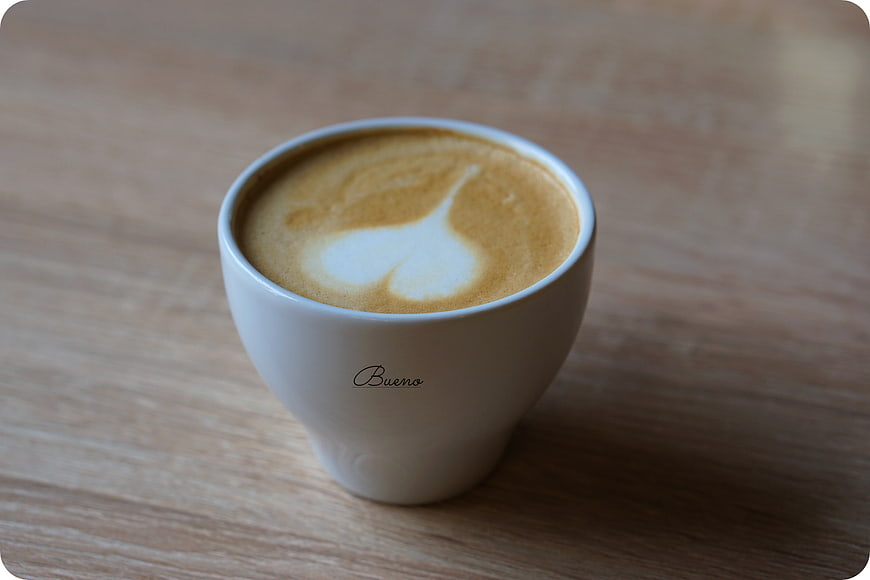 Cappuccino with Heart Latte Art on Wooden Table
