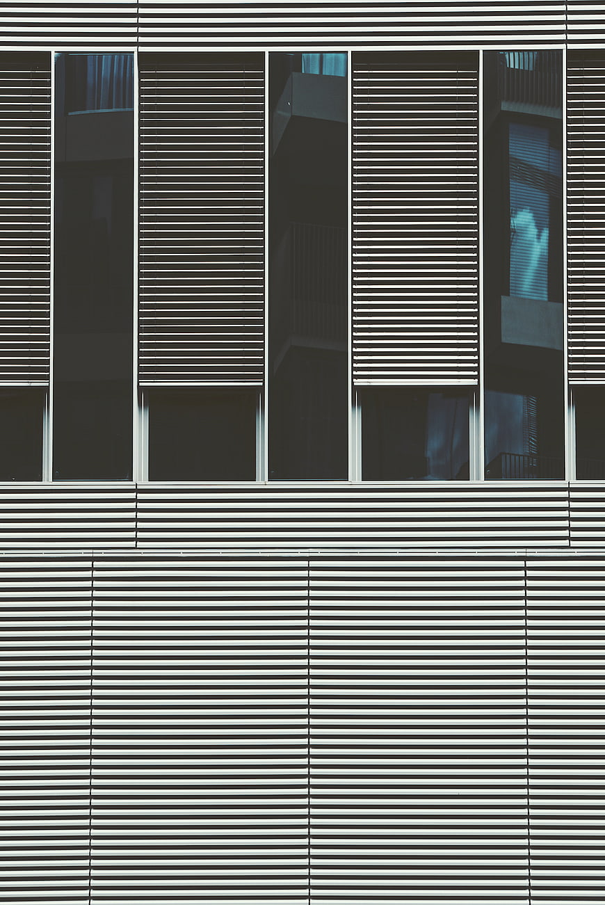 Modern building facade with horizontal slats and glass windows