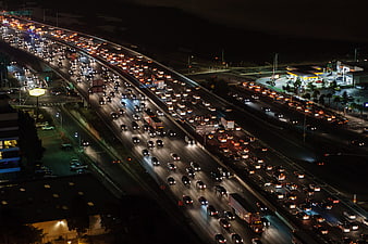 Aerial night view of heavy traffic on a busy multi-lane highway