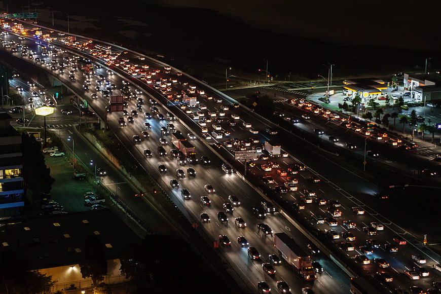 Aerial night view of heavy traffic on a busy multi-lane highway