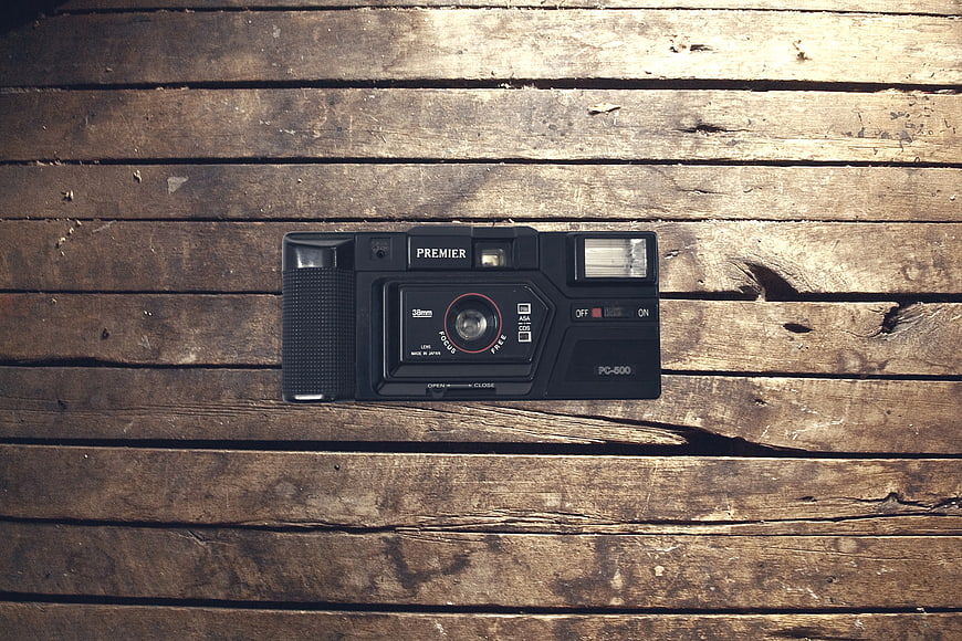 Vintage Black Premier Film Camera on Rustic Wood