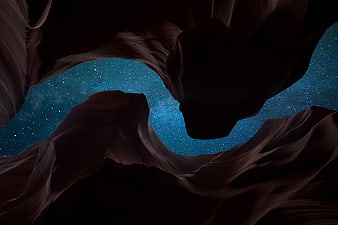 Starry Night Sky Viewed Through Dark Canyon Rock Formations
