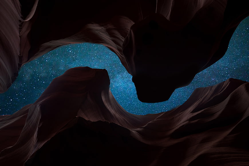 Starry Night Sky Viewed Through Dark Canyon Rock Formations