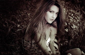 Sepia Portrait of Young Woman in Wild Grass