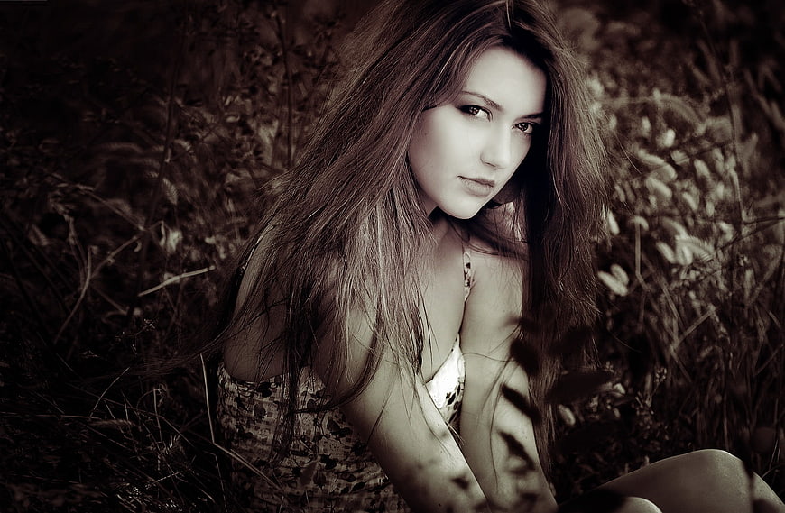 Sepia Portrait of Young Woman in Wild Grass