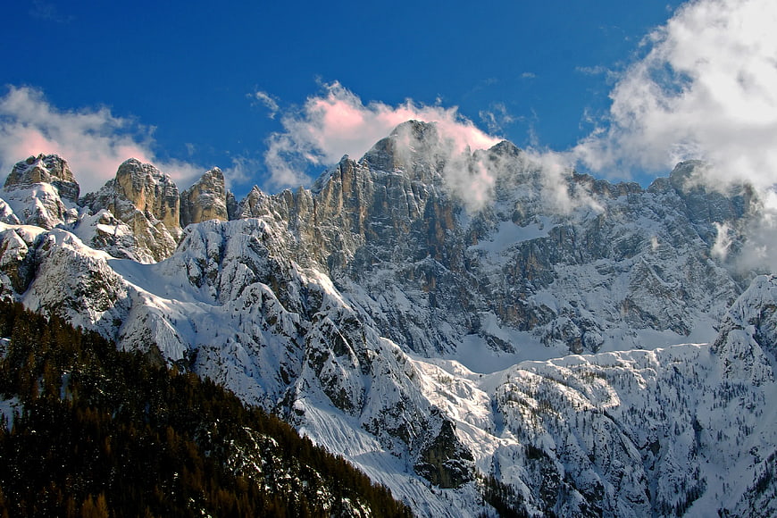 Snow-Covered Mountain Peaks with Pink Clouds