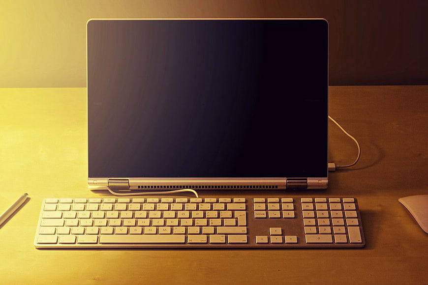 Modern Workspace Setup with Laptop, Keyboard, and Mouse
