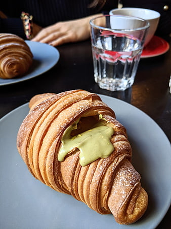 Pistachio Croissant Pastry on Plate in Cafe