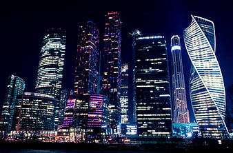 Moscow City skyline at night with illuminated skyscrapers