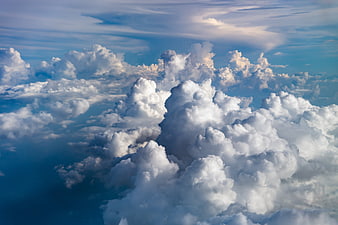 Dramatic Cumulus Clouds in Blue Sky from Above