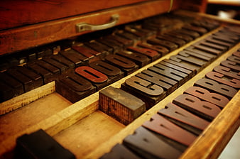Vintage wooden letterpress blocks in a drawer