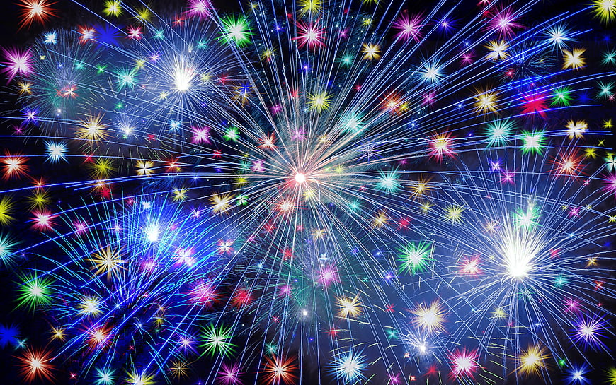 Colorful fireworks exploding in night sky celebration