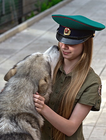 Woman in Military Uniform with Siberian Husky