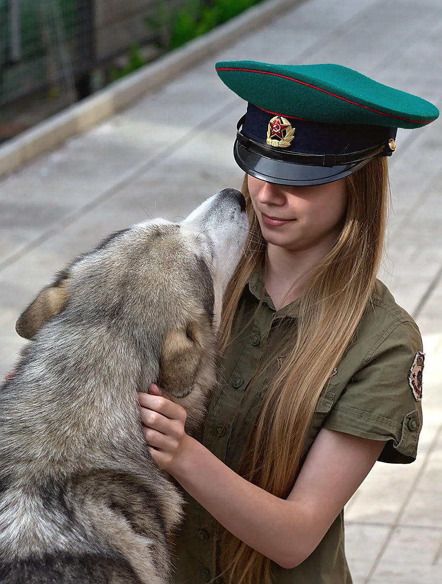 Woman in Military Uniform with Siberian Husky