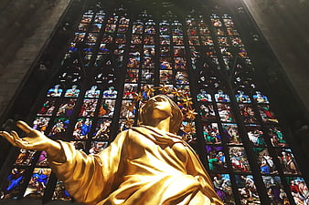 Golden Statue of Jesus in Milan Cathedral Stained Glass