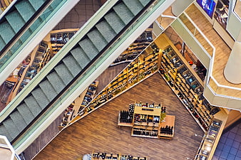 Aerial View of Modern Department Store Interior with Escalators and Shelves