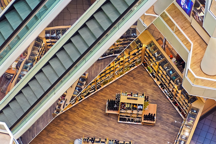 Aerial View of Modern Department Store Interior with Escalators and Shelves