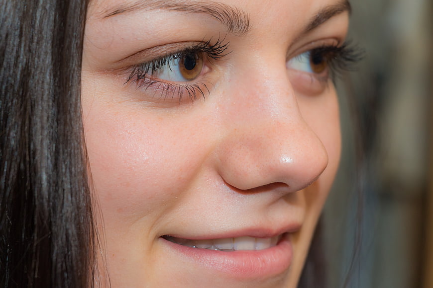 Close-up of young woman's smiling face and eyes