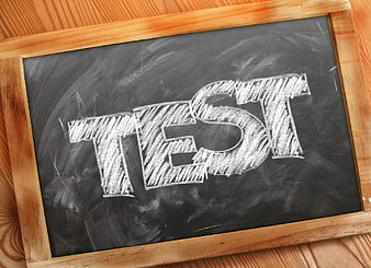 Word Test Written in Chalk on Blackboard