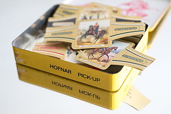Vintage cigar bands in yellow tin box