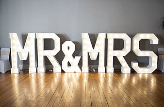 Illuminated Mr and Mrs Marquee Letters on Wooden Floor