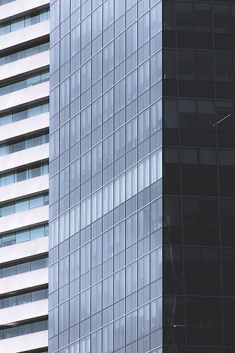 Modern Glass Office Building Facade with Geometric Patterns
