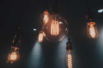 Vintage Edison Light Bulbs Hanging in Dark Room