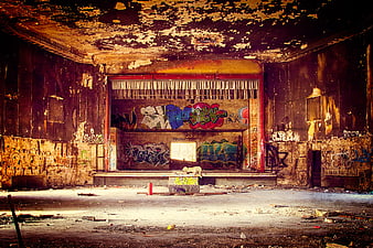 Abandoned Theater Interior With Colorful Graffiti And Peeling Walls