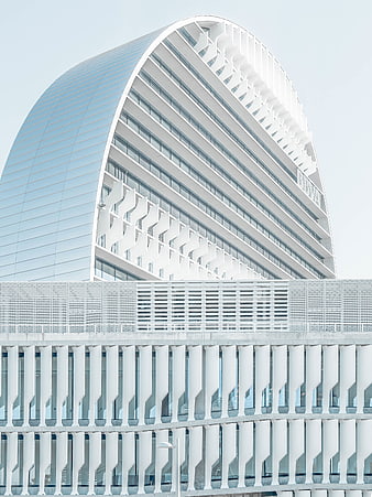 Modern white curved architecture with geometric facade details
