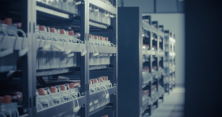 Rows of battery racks in a data center or server room