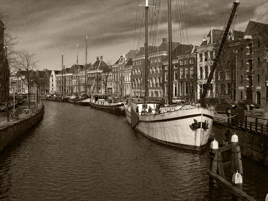 Vintage Black and White Photo of Canal Boats in Amsterdam