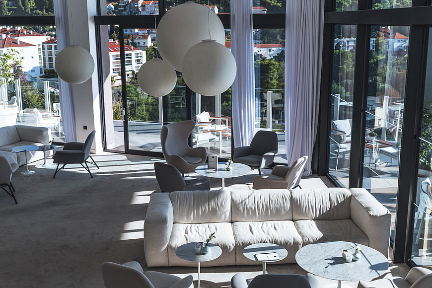 Modern Hotel Lobby Interior with Large Windows and Lounge Furniture