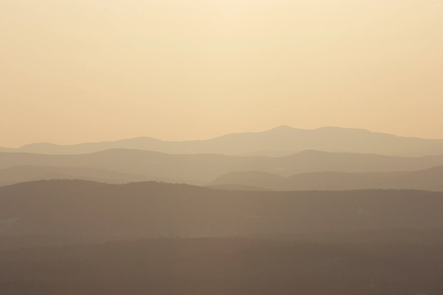 Hazy Mountain Layers at Sunset