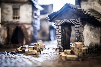Miniature model village with stone houses and cobblestone street