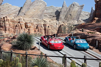 Red and blue Cars Land ride vehicles at Disney California Adventure