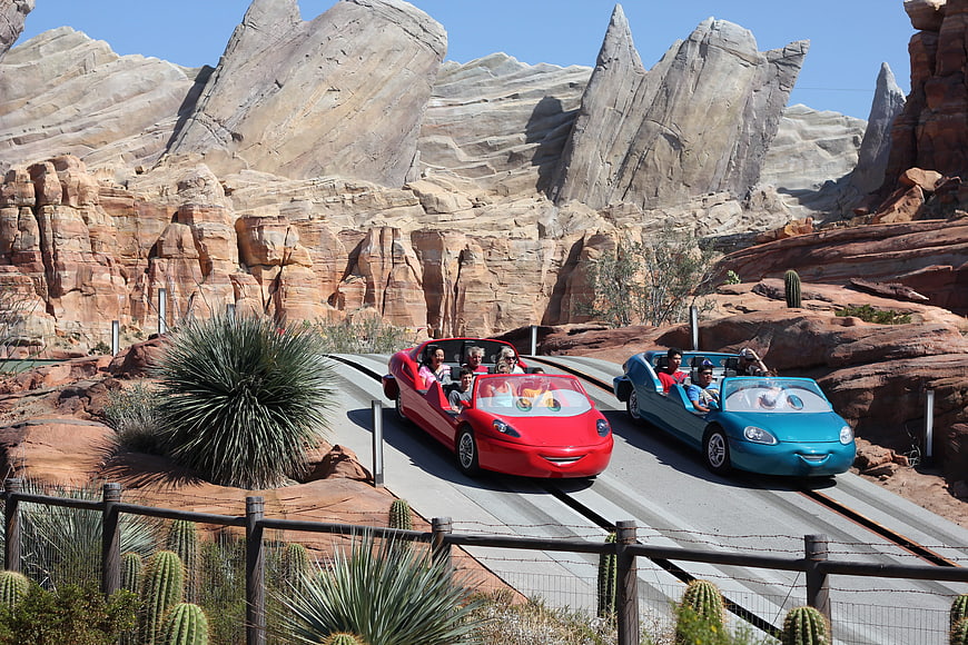 Red and blue Cars Land ride vehicles at Disney California Adventure