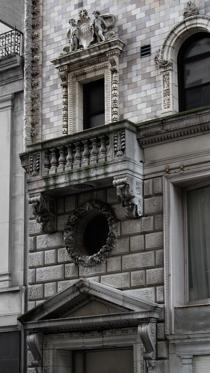 Ornate Stone Architecture Detail with Balcony and Sculptures