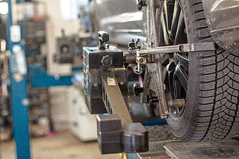 Close-up of car wheel alignment equipment in auto repair shop