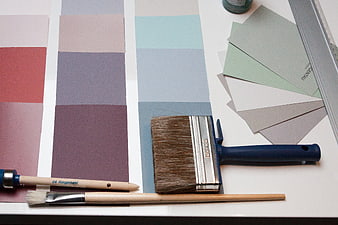 Interior Design Color Palette and Paint Brushes on White Table
