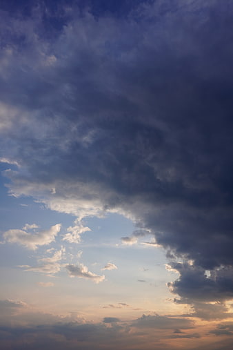Dramatic Storm Clouds Over Sunset Sky