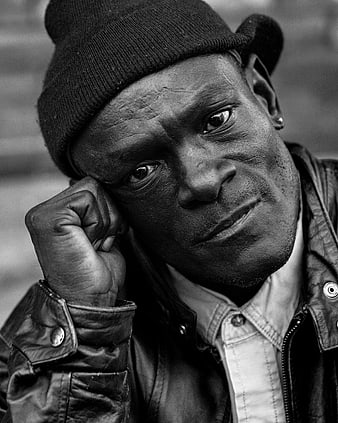 Black and white portrait of a man in a beanie