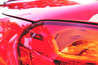 Close-up of Red BMW Headlight Detail